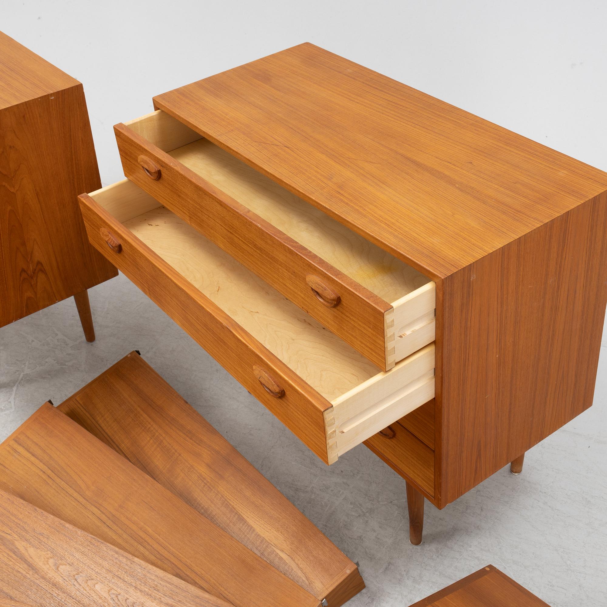 A teak and teak veneered shelf system, mid 20th century.