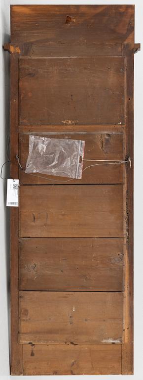 An Empire style mirror, second half of the 20th century.