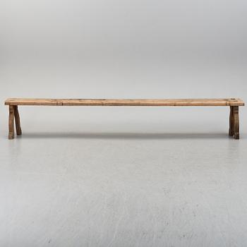 A 19th century folk art bench.