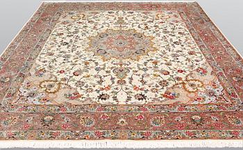 A Tabriz part silk carpet, 297 x 253 cm.
