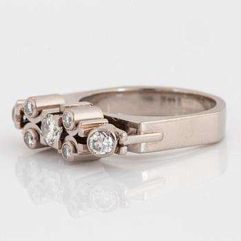 A Claës Giertta 18K white gold ring set with round brilliant-cut diamonds.