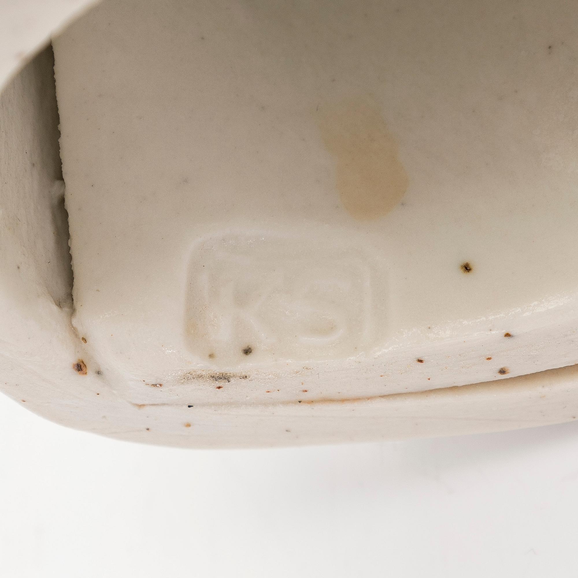 Kyllikki Salmenhaara, a 'winding' stoneware sculpture signed KS.