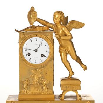 An Empire ormolu figural mantel clock, early 19th century.