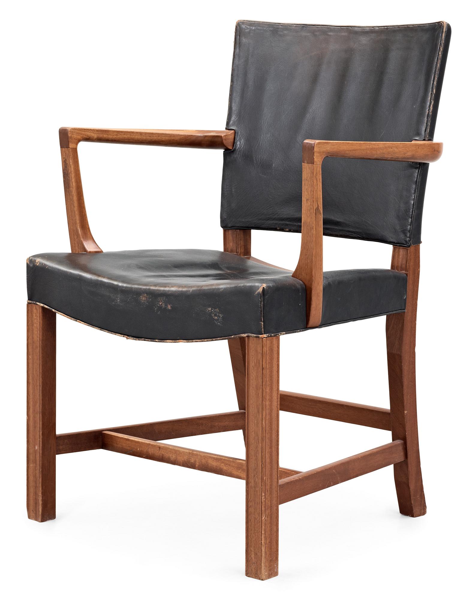 A Kaare Klint mahogany and black leather armchair by Rud Rasmussen snedkerier, Denmark.
