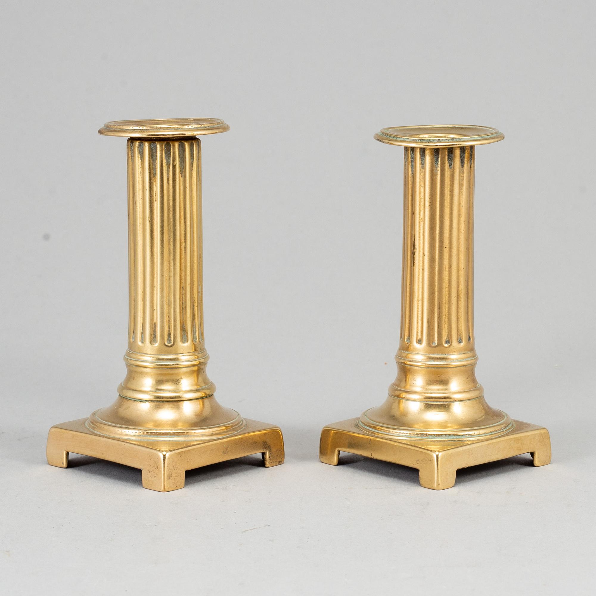 A pair of Louis Seize bronze candlesticks, late 18th century.