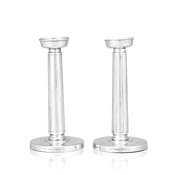 83. Gustaf Janson, a pair of sterling candlesticks, C.G Hallberg Stockholm 1961.