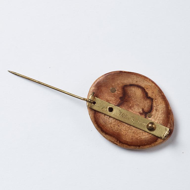 Vivianna Torun Bülow Hübe, a wood and brass brooch, executed in her own workshop in Stockholm ca 1952.