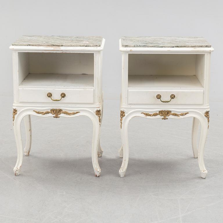 A pair of early 20th century rococo style bedside tables with marble top.