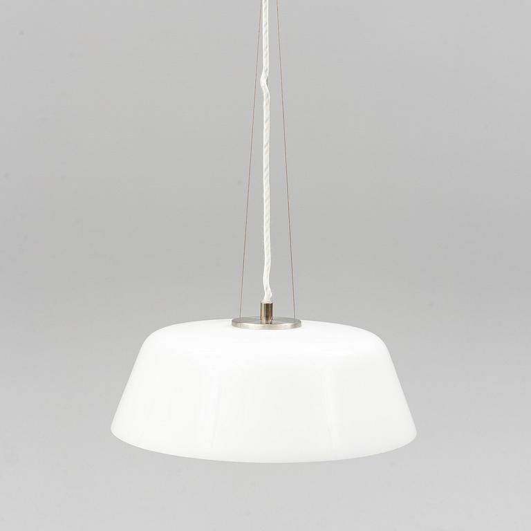 An Arne Jacobsen "Centenary Package" comprising three "Ant Chairs" and an eggshaped table, Fritz Hansen, Denmark.