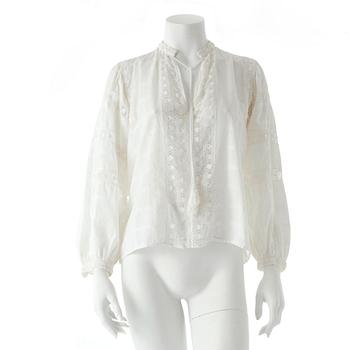 487. YVES SAINT LAURENT, a white cotton blouse.
