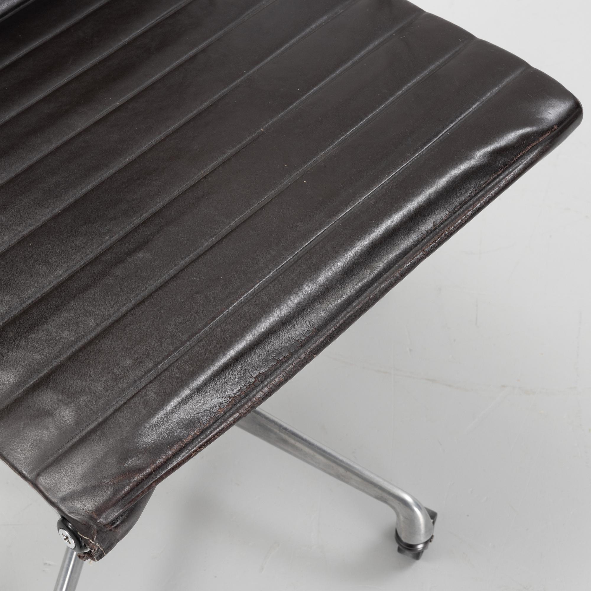 An EA 118 swivel office chair by  Charles and Ray Eames for Herman Miller, designed 1958.