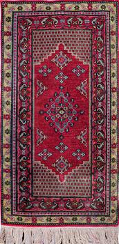 A rug, Oriental silk, ca 141 x 70 cm.