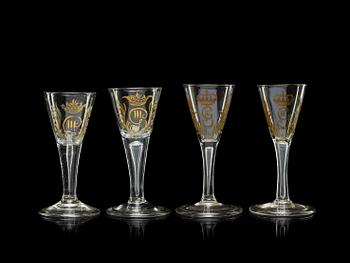 704. A set of four armorial wine goblets, 18th Century.