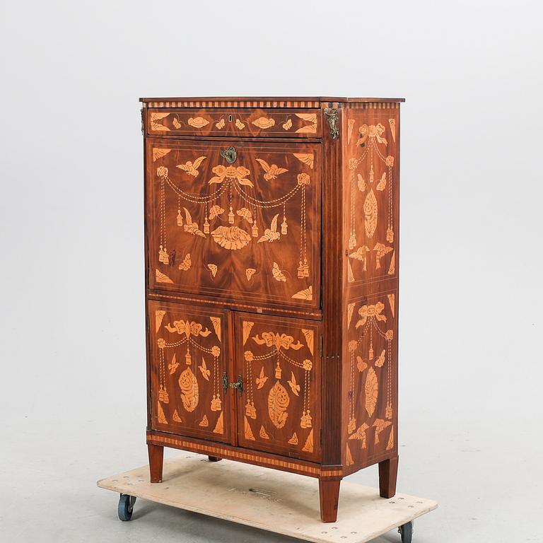 A Louis XV mahogany secretaire around 1800.