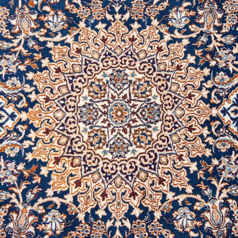 A carpet, Nain, part silk, ca. 295 x 201 cm.