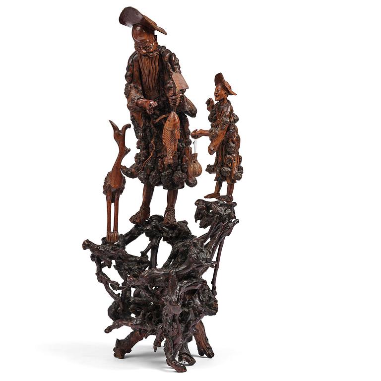A large well sculptured root sculpture of 'Sholau and attendant', late Qing dynasty, 19th century.