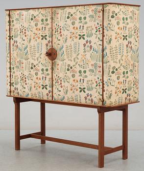 A Josef Frank mahogany cabinet, doors and sides covered in Frank's floral chintz fabric 'Fatima', Svenskt Tenn ca 1937.