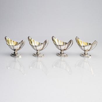 Four English 18th century silver salt-cellars, mark of William Fountain & Daniel Pontifax, London 1791, and spoons.