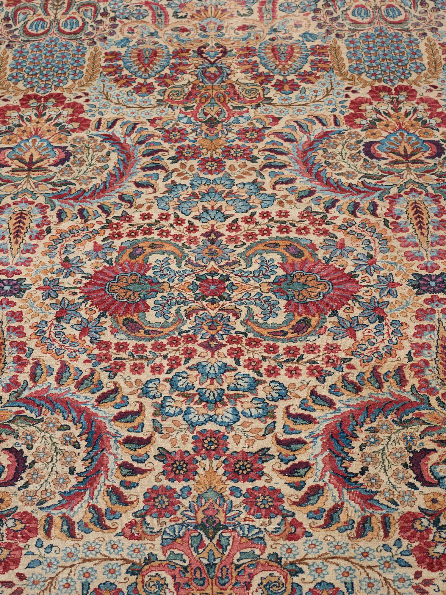 A carpet, a semi-antique Kerman, ca 375-379,5 x 268-271 cm.