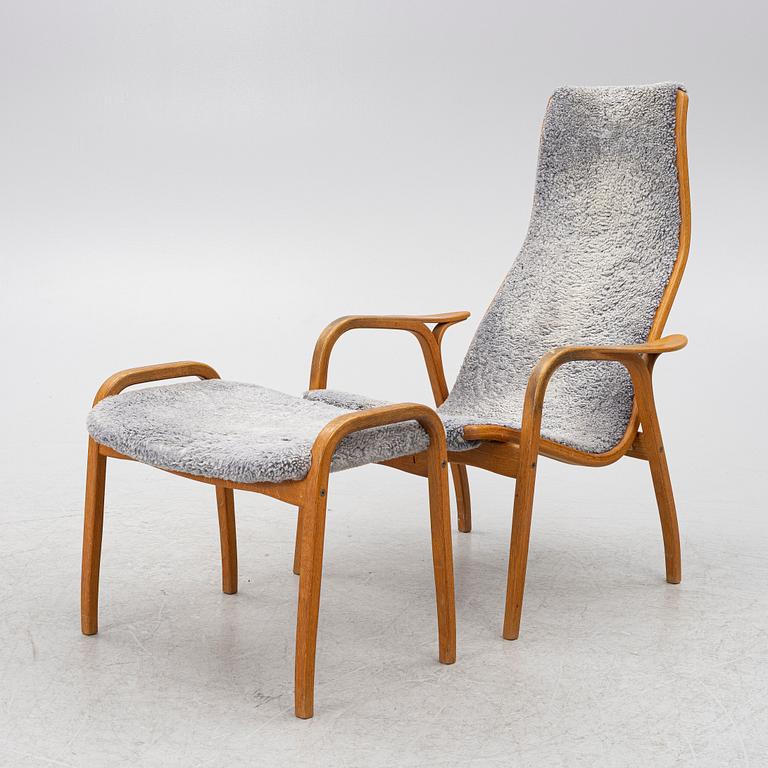 Yngve Ekström, a 'Lamino' armchair with ottoman and sidetable, Swedese, Sweden, 21st century.