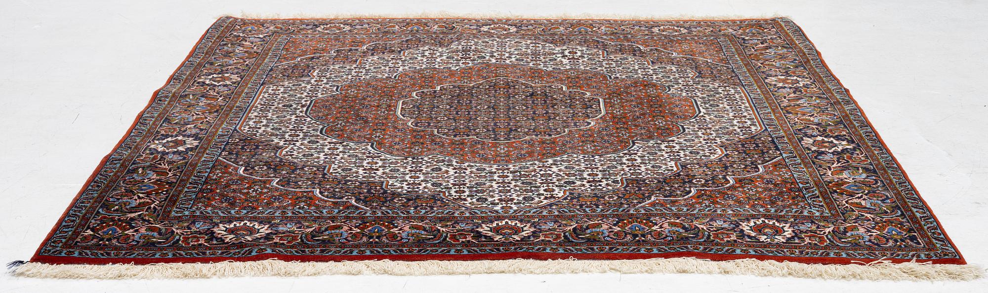 An Oriental rug, approx. 213 x 201 cm.
