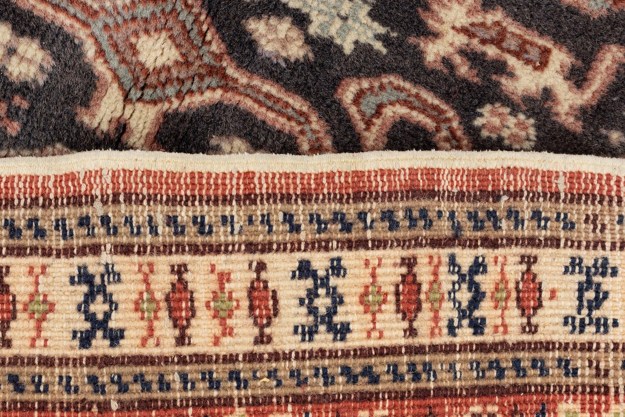 A carpet, semi antique/old, possibly Ardabil, c. 180 x 115 cm.