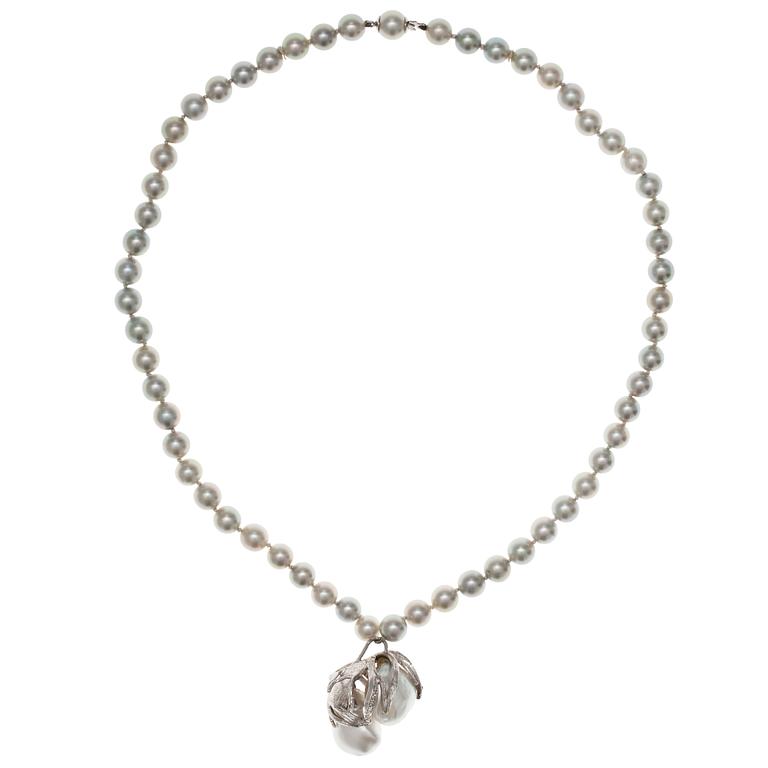 A NECKLACE, 18K white gold, akoya pearls 7 mm and 2 large baroque south sea pearls.