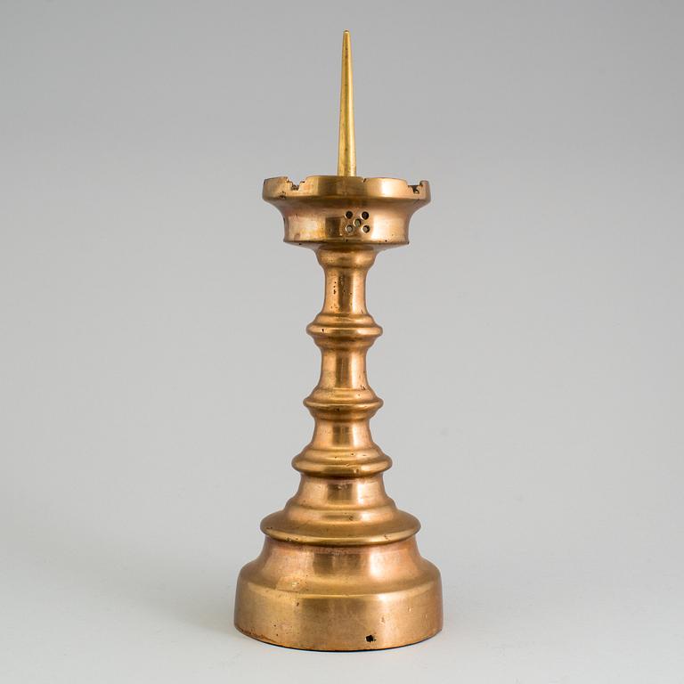 A GOTHIC STYLE BRONZE CANDLESTICK, 19th century.