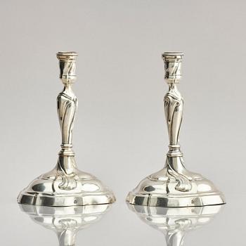 A pair of German silver Rococo candlesticks, marks of Johann Jacob Baur, Augsburg 1777-1779.