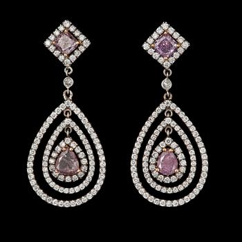 853. A pair of Fancy coloured diamond, total carat weight circa 1.59 cts and colourless diamond earrings.