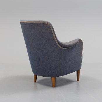 A lounge chair by Carl Malmsten, around the mid 20th century.