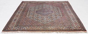 An oriental rug, approx. 238 x 174 cm.