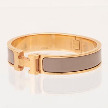 Hermès, "Clic H" bracelet in enamel with rose gold-plated hardware.