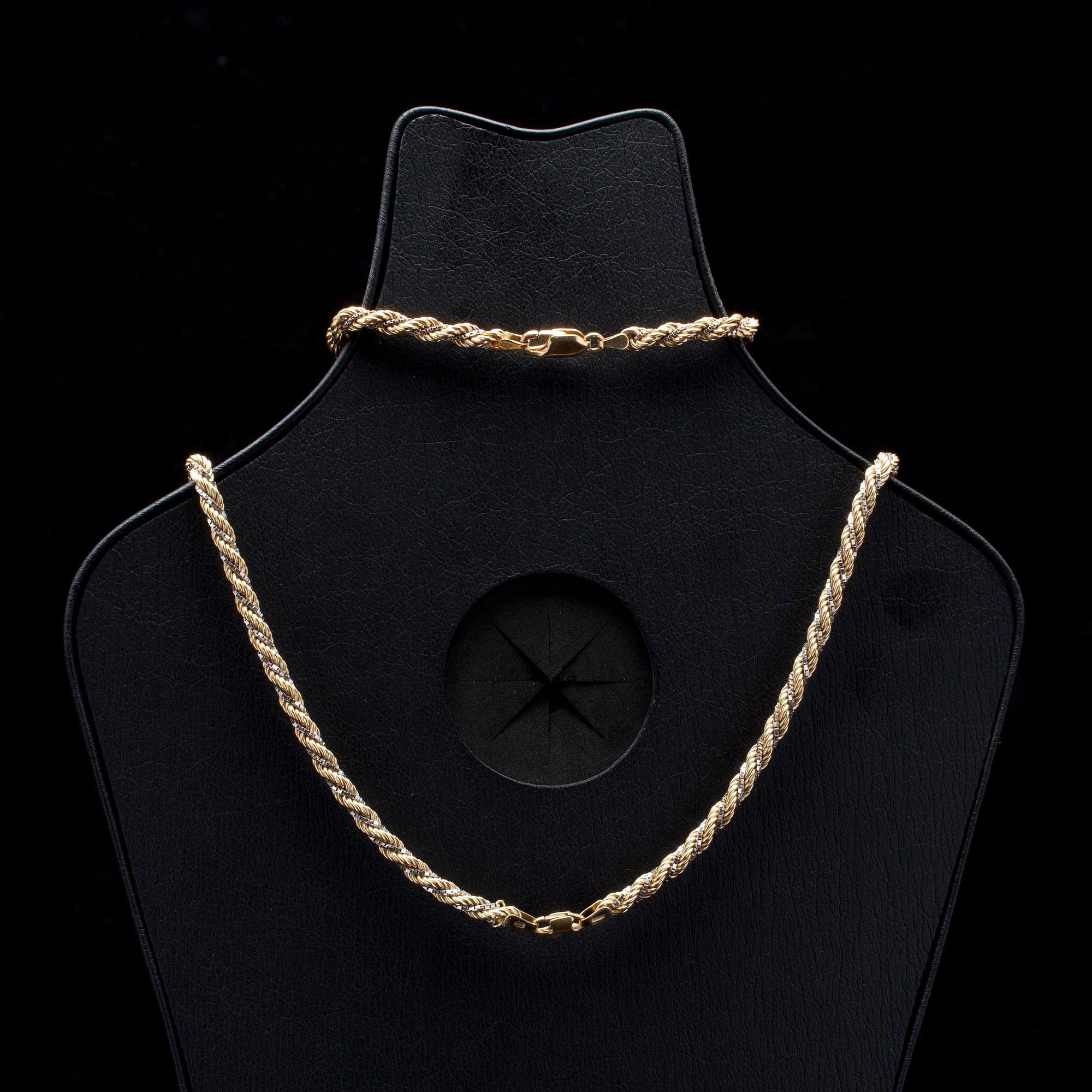 HALS- och ARMKED, tvåfärgsguld 18K, italienska stämplar. Vikt 37,9 g.