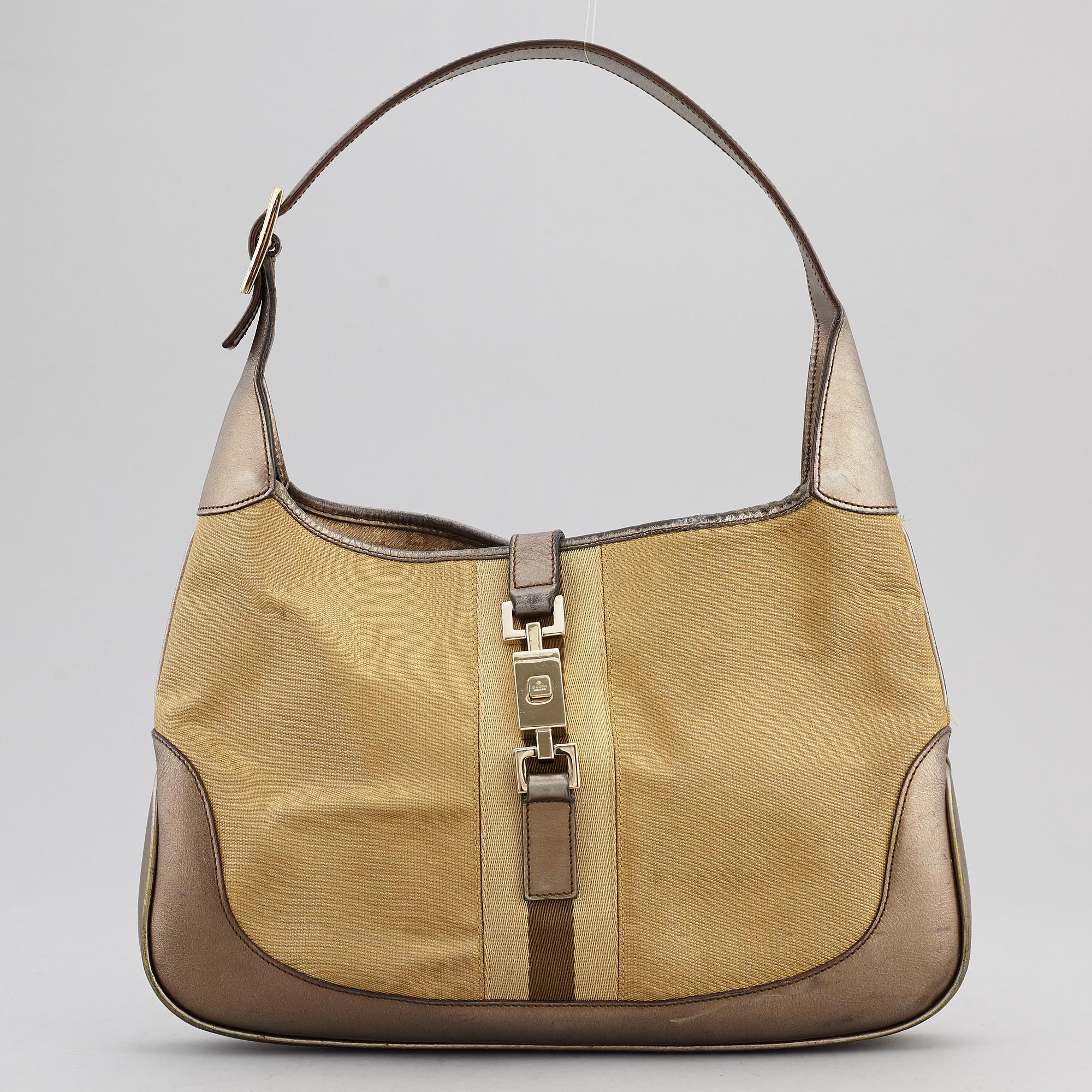 GUCCI, a metallic bag.