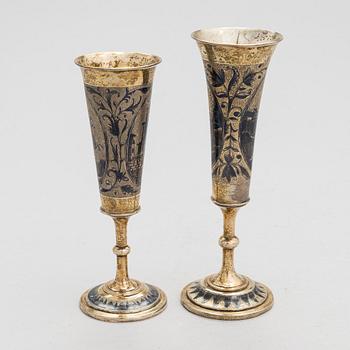 Two gilt silver and niello champagne flutes, Moscow 1842 and 1844. Unidentified maker's mark AK.