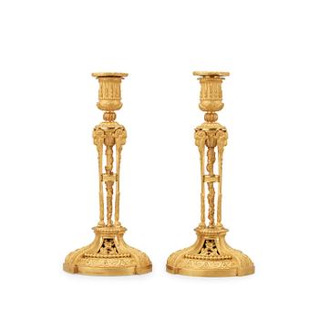 1628. A pair of Louis XVI-style candlesticks, presumably early 20th century.