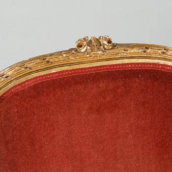 A pair of lounge chairs from the first half of the 20th century.
