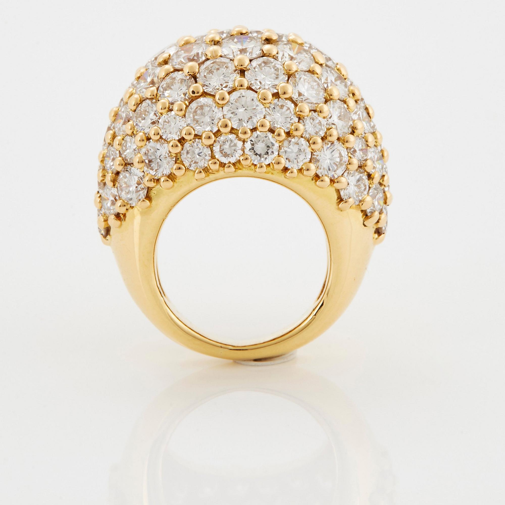 Cartier "Marrakech" an 18K gold bombé ring set with round brilliant-cut diamonds.