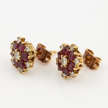 Earrings, a pair, 18K gold with rubies and brilliant-cut diamonds.