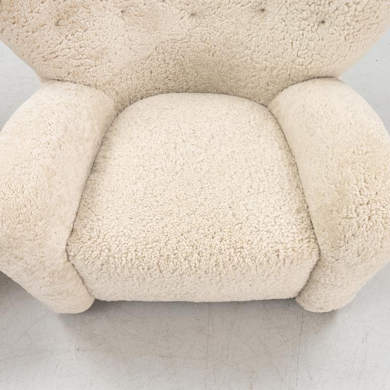 A 'The tired man' lounge chair with stool by Flemming Lassen by Lassen, designed 1935.