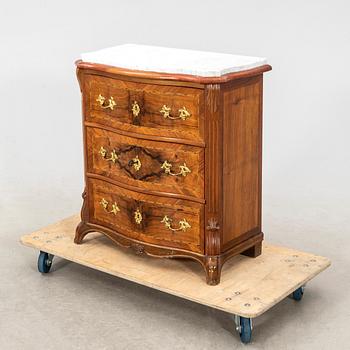 A Neo Renaissance walnut chest of drawers.