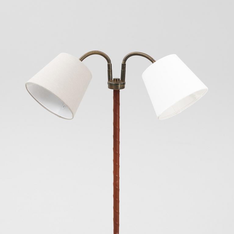 A mid 20th Century double headed floor lamp.