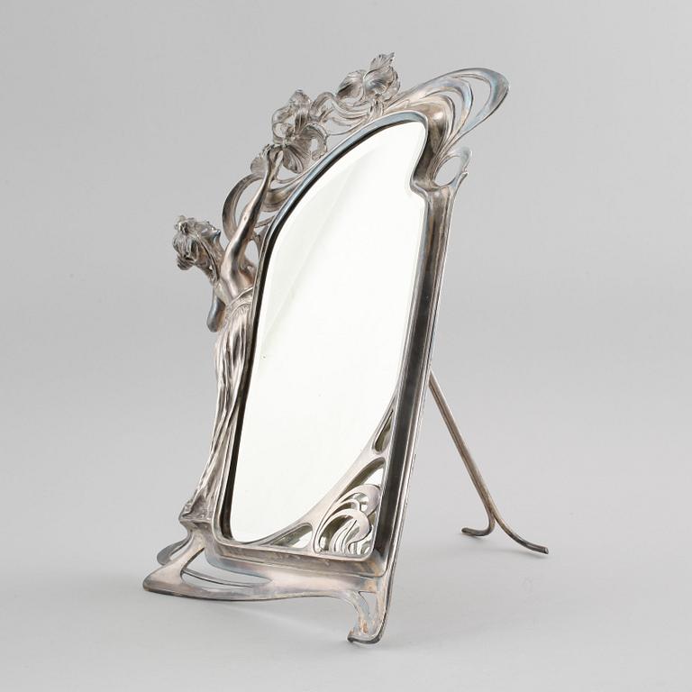 A jugend table mirror in electroplated nickel silver, made in the beginning of the 20th century.