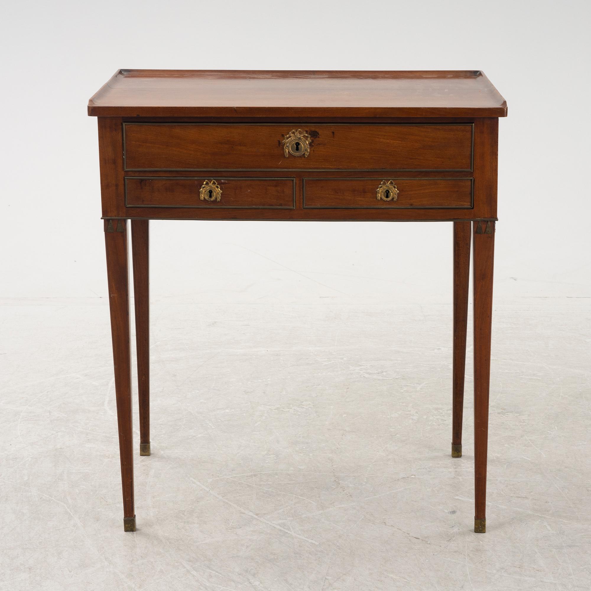 A late Gustavian mahogany writing table from araound the year 1800.