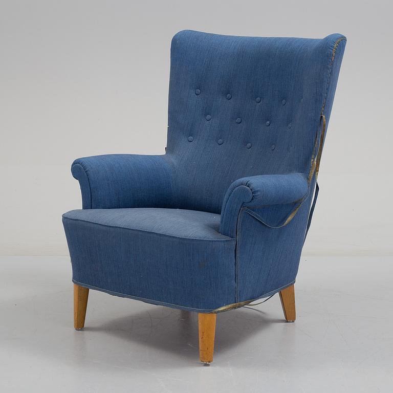 A mid 20th century armchair, possibly designed by Carl Malmsten.