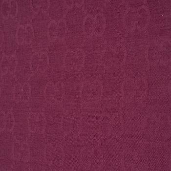 Gucci, a wool and silk mix "GG" jaquard shawl.