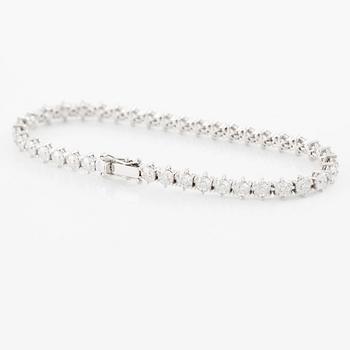 Tennis bracelet, 18K white gold with fancy-cut diamonds.