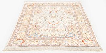 A double-nisch silk Hereke rug, c. 125 x 78 cm.