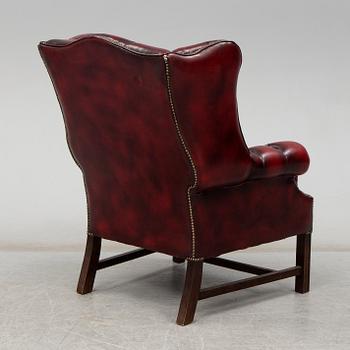 A late 20th Century leather easy chair.